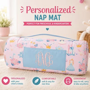 May include: A pink personalized nap mat with a blue handle and a blue rectangular patch embroidered with initials. The mat features a floral and castle pattern. Text on the mat reads "Personalized NAP MAT".