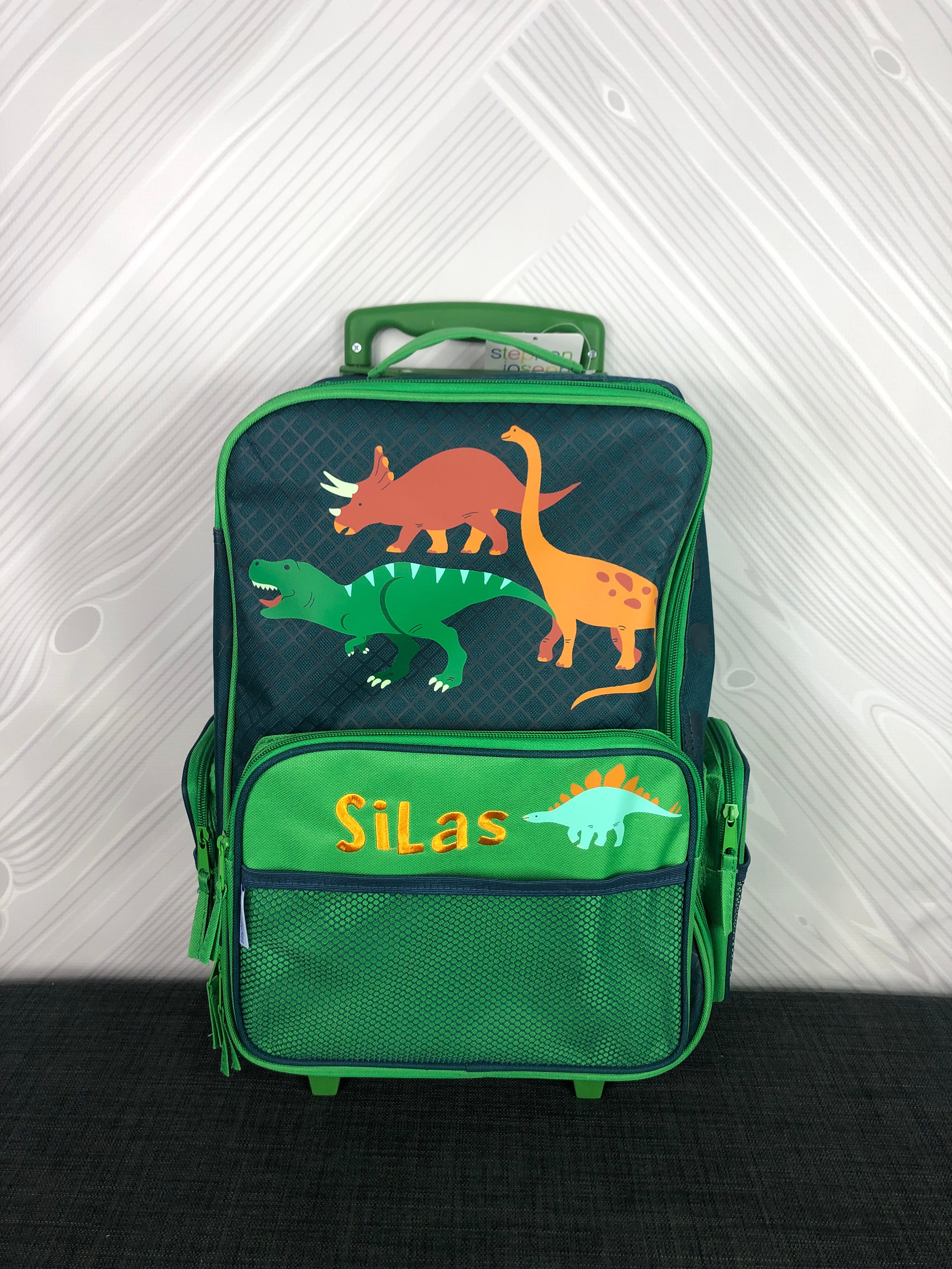 dinosaur rolling luggage