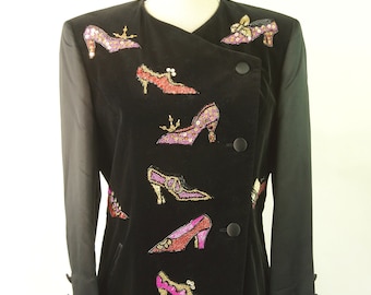 May include: A black velvet blazer with a unique design featuring embroidered high-heeled shoes in various colors, including pink, red, and gold.