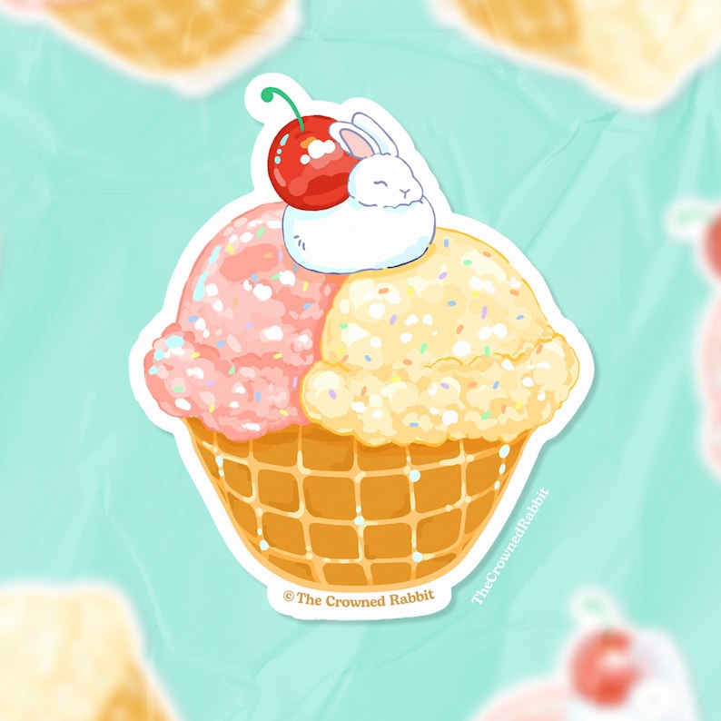 Peut inclure: Un lapin blanc avec une cerise rouge sur un cornet de gaufre rempli de glace rose et jaune. Le cornet est recouvert de p&eacute;pites et le texte "The Crowned Rabbit" est en bas.