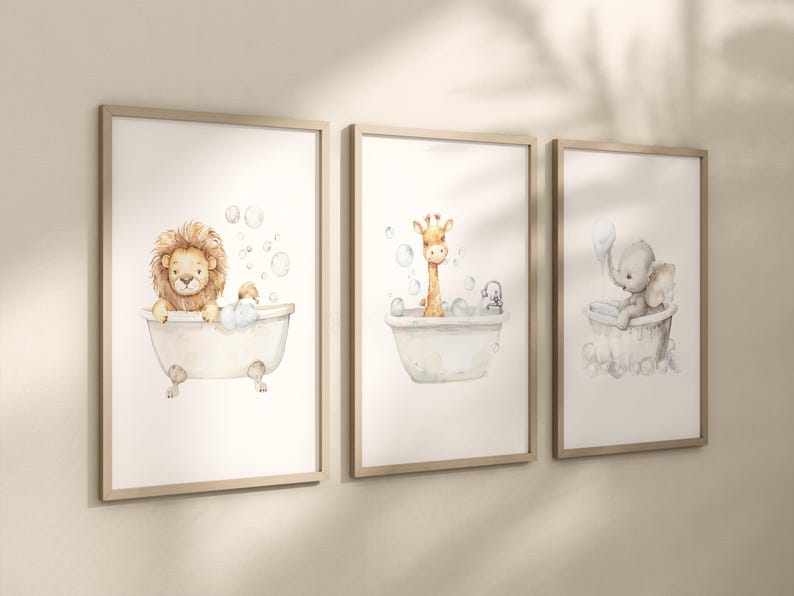 May include: Three framed watercolor prints featuring adorable animals in bathtubs. A lion, giraffe, and elephant are depicted in vintage-style tubs with bubbles. The prints have a soft, pastel color palette and are framed in light wood.