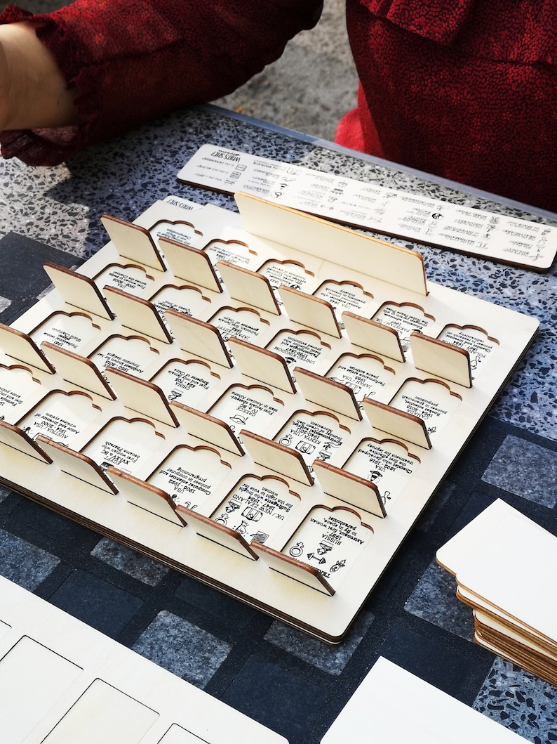 Whos She guessing game beautifully finished in birch wood. Entirely made(designed, produced, assembled & packed) in Poland. This game is modular, you can add and exchange women's stories. Check out  expansion packs.