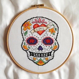 Cross stitch pdf file of Day of the Dead sugar skull Amor. Download available once payment is received. image 1