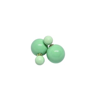 May include: A pair of green double-sided earrings with a larger ball on one side and a smaller ball on the other side.