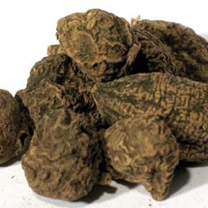 May include: A pile of dried, brown, knobby roots. The roots are irregularly shaped and have a rough, textured surface.
