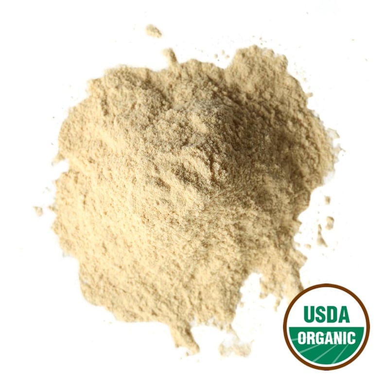 May include: A heap of light brown powder on a white backdrop. The powder has a fine texture and appears to be a food product. A USDA Organic seal is in the bottom right corner.