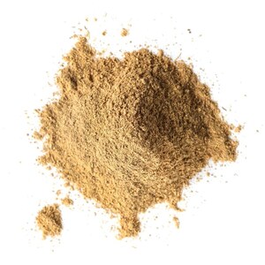 May include: A pile of light brown powder against a white background. The powder has a fine texture and appears to be a spice or herb. The image is a top-down view, with the powder taking up most of the frame.