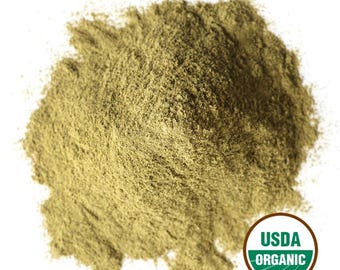 May include: A pile of finely ground, light green powder against a white background. The powder has a slightly textured appearance. A USDA Organic seal is visible in the lower right corner.