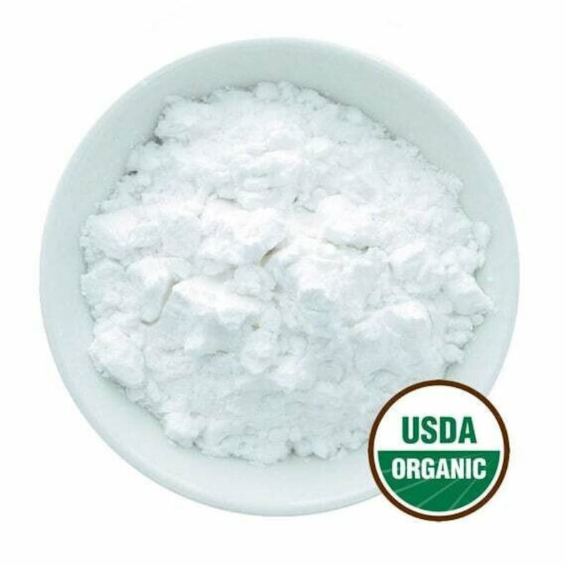 White arrowroot powder in a bowl with USDA Organic label on a white background.