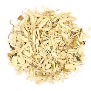 May include: A pile of dried, light brown, shredded ginseng root.