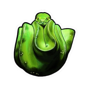 May include: A sticker depicting a bright green snake in a coiled pose. The snake's head is central, with yellow eyes and a black outline. The sticker has a white border.