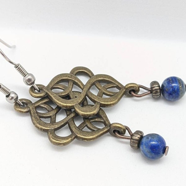 Celtic knot earrings, blue lapis lazuli gemstone earrings in brass bronze color, on surgical stainless steel ear wires, dark blue bead