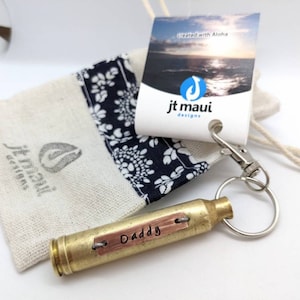 comes in a fabric gift bag. current color of bag is neutral tan. brass casing with copper plate. Example shown is a gift for daddy, great gift for men, with custom word or name of your choice.