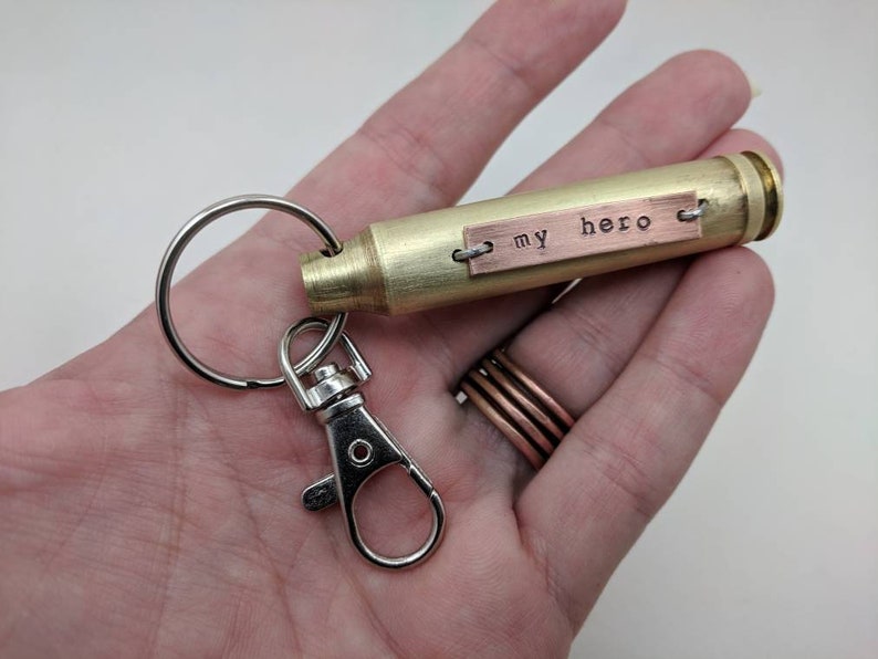 This example shows the words my hero in lowercase typewriter font, on a hand pounded copper plate. unique gift for military service person, veteran, or military spouse.