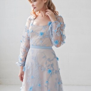 Azura blue bridal bodysuit in 3D flowers fabric, with a soft square neckline and see through poet sleeves. image 2