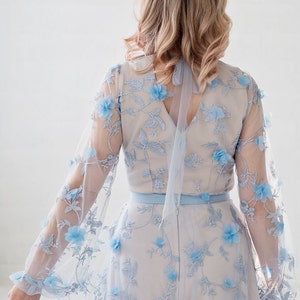 Azura blue bridal bodysuit in 3D flowers fabric, with a soft square neckline and see through poet sleeves. image 4