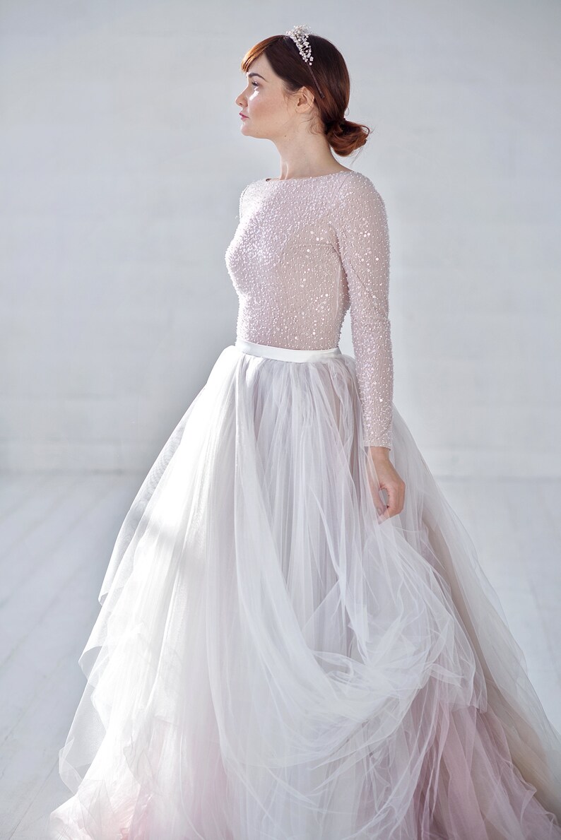 Long sleeve wedding dress with tulle skirt information