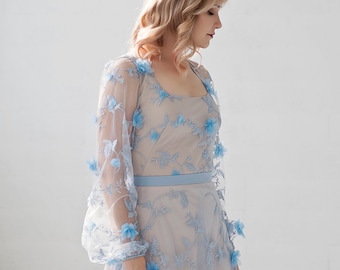 Azura - blue bridal bodysuit in 3D flowers fabric, with a soft square neckline and see through poet sleeves.