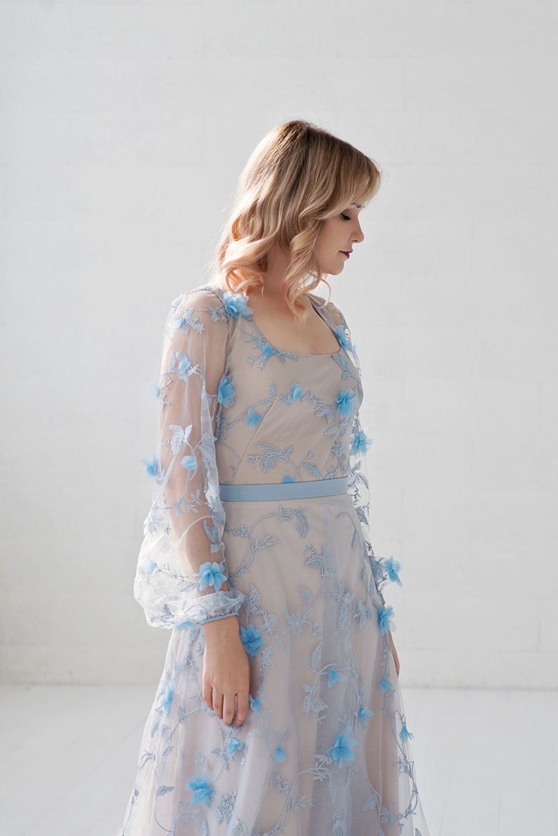 Azura blue bridal bodysuit in 3D flowers fabric, with a soft square neckline and see through poet sleeves. image 1