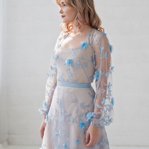 Azura blue bridal bodysuit in 3D flowers fabric, with a soft square neckline and see through poet sleeves. image 3