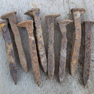 Lot of eight wonderfully worn railroad spikes. Decorative railroad hardware. Rare vintage railroad history.  Free shipping!