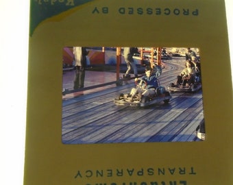 Lot of eight original Kodak slides. Kids at the amusement park. Go-Carts 1960's. Great shape.