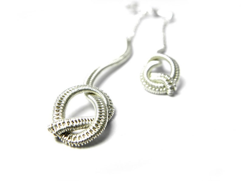 Knotted earrings in woven Sterling silver.