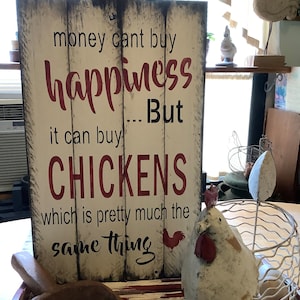 Money can’t buy happiness But it can buy Chickens Sign.