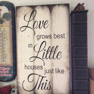 Love grows best in little houses. Rustic sign