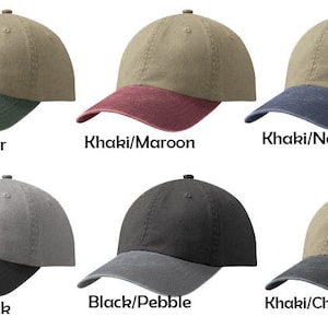 May include: Six different two-tone baseball caps. The caps are made of a soft, textured fabric. The caps are available in a variety of colors, including khaki, black, hunter green, maroon, navy, and charcoal.