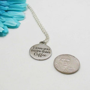 May include: Silver necklace with a round pendant that says "I love you more than coffee".