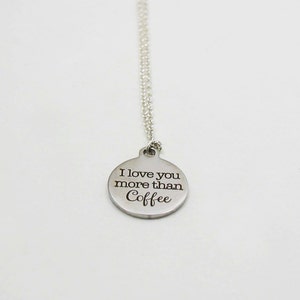 May include: Silver necklace with a round pendant that says "I love you more than coffee".