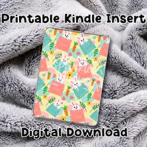May include: Printable Kindle insert with a yellow background and a repeating pattern of white bunnies peeking out of pink and blue boxes with carrots and flowers. The text "Printable Kindle Insert" is at the top of the image and "Digital Download" is at the bottom.