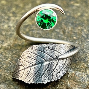 Handcrafted one of a kind adjustable sterling silver real butternut with emerald green cubic zirconia ring
