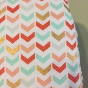 Fitted Crib Sheet in broken chevron design, teal, fuzzy peach, coral, gold, elastic all around and mitered corners, Fast Free Shipping