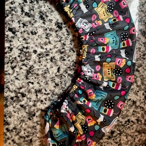 Waterproof Sound Bar Cover in movie popcorn design PUL that is  soft fabric on the inside. Custom made to your dimensions.