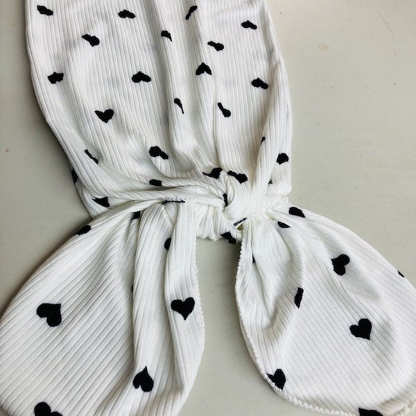 Knotted baby gown (tie bottom) with or without mitten cuff, ribbed stretchy white fabric with black hearts with three sizes to choose from