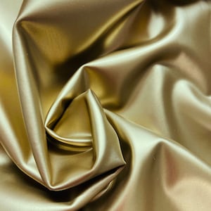 Elegant waterproof sound bar cover in gold PUL, waterproof on the outside and soft fabric on the inside.  Custom made to your dimensions.