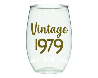 May include: Clear plastic wine glass with a gold vinyl decal that says "Vintage 1979".