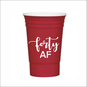 May include: Red plastic cup with white text that says "forty AF".