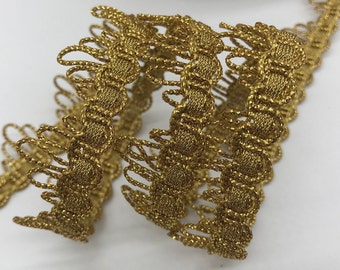 May include: Gold metallic trim with a scalloped edge and a textured design.