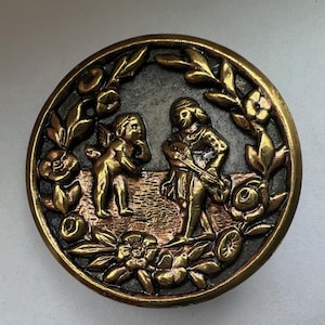 Large Victorian picture button, Cupid and Erato, 1-7/16"