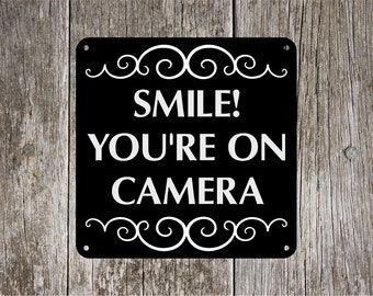 Smile! You're on Camera  8 inch x 8 inch Aluminum Sign