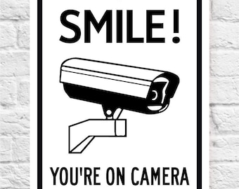 SMILE! You're On Camera Metal Sign