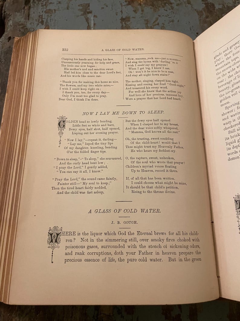 May include: A vintage book with yellowed pages and a text excerpt from the poem "Now I Lay Me Down to Sleep." The poem is about a child praying before bed. The book is open to a page with the title "A Glass of Cold Water" and the author J.B. Gough.