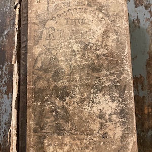 May include: A vintage book titled "The Progressive Third Reader" by Oliver Ellsworth, with a worn brown cover and a faded illustration of three people.