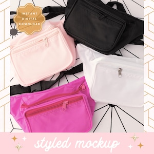 May include: Three different styles of fanny packs. The first is black, the second is pink, and the third is white. All three have a zipper closure.