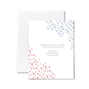 May include: A white card with a red and blue star design. The card has the text "you may not put on a uniform but you serve and sacrifice you are seen you are amazing we thank you".