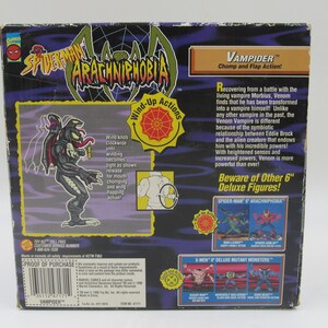 May include: A black and red action figure of Venom, a Spider-Man villain, in a vampire form. The figure has a wind-up action feature. The packaging features the text "VAMPIDER" and "Chomp and Flap Action!" The back of the box shows other action figures from the Spider-Man and X-Men series.