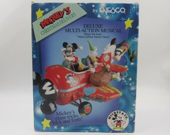 Enesco Mickey's Christmas Delivery Deluxe Wielofunkcyjna figurka muzyczna w kształcie samolotu